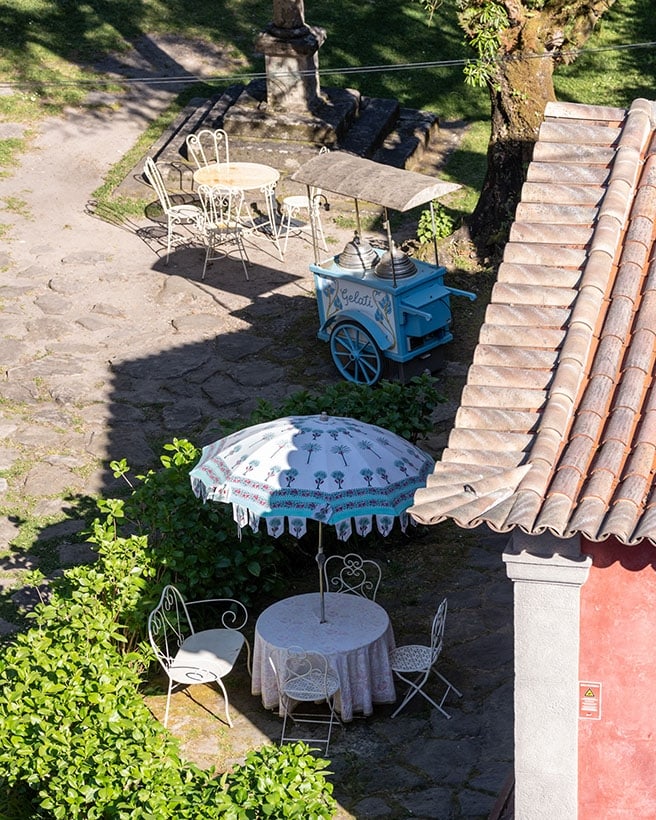 Café tables in the cobbled courtyard